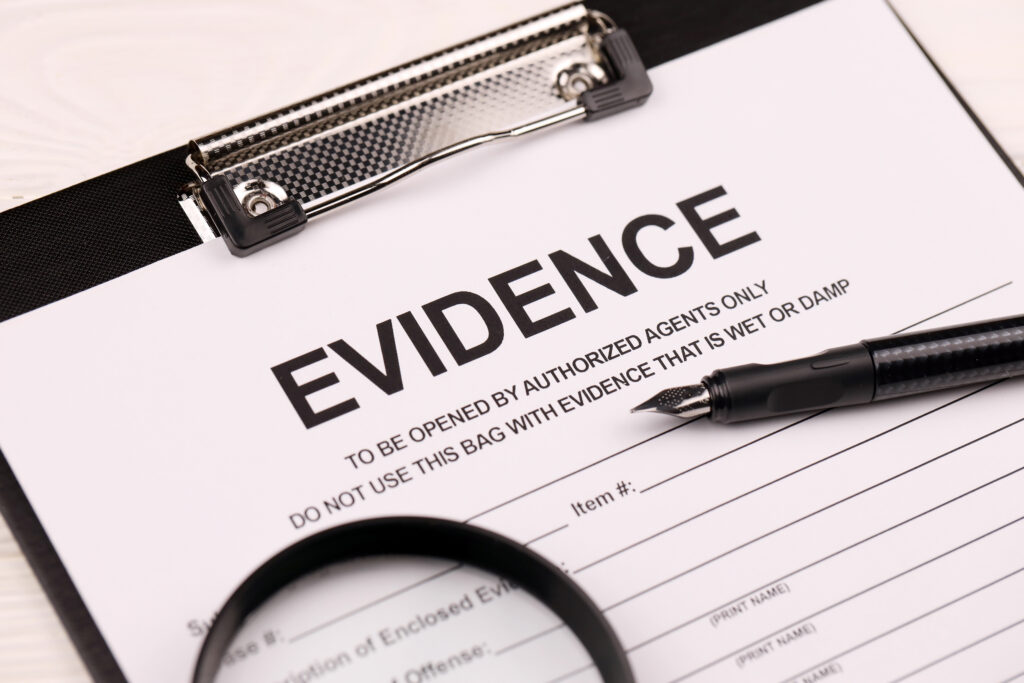Organised evidence documents on a desk, representing the proof needed to demonstrate talent or promise for the Global Talent visa.
