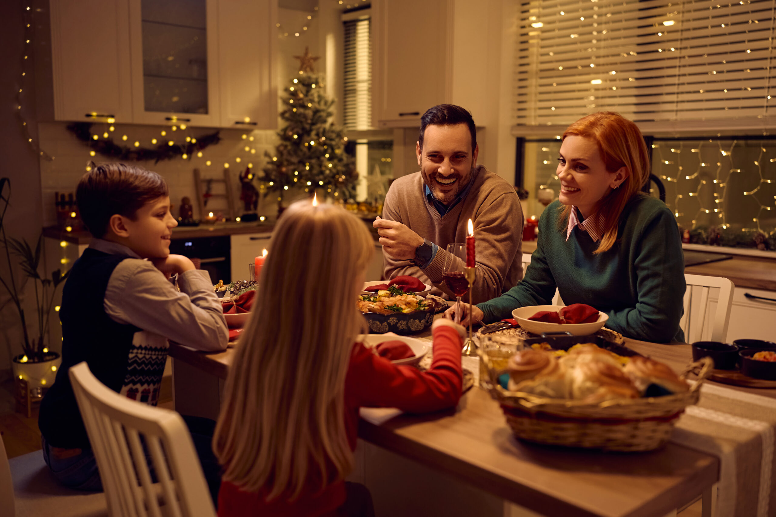 A happy family sharing dinner at home, symbolising togetherness for Global Talent visa dependants.