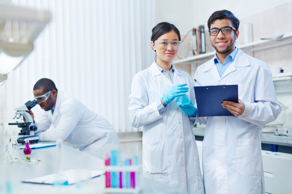 Illustration of a scientist in a UK research lab reviewing data and collaborating with international colleagues, symbolising opportunities under the Global Talent visa.