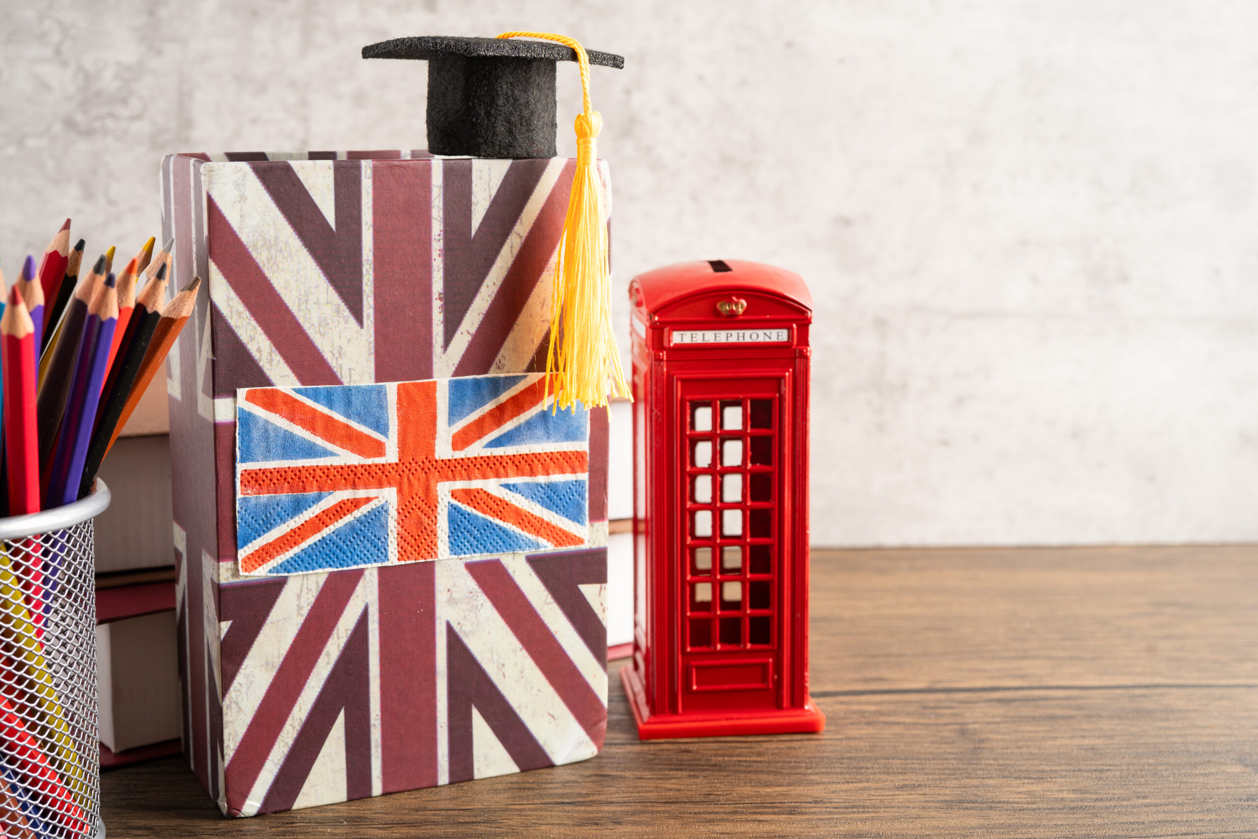 A university campus in the UK with international academics collaborating, symbolising universities recruiting Global Talent visa holders in 2025.