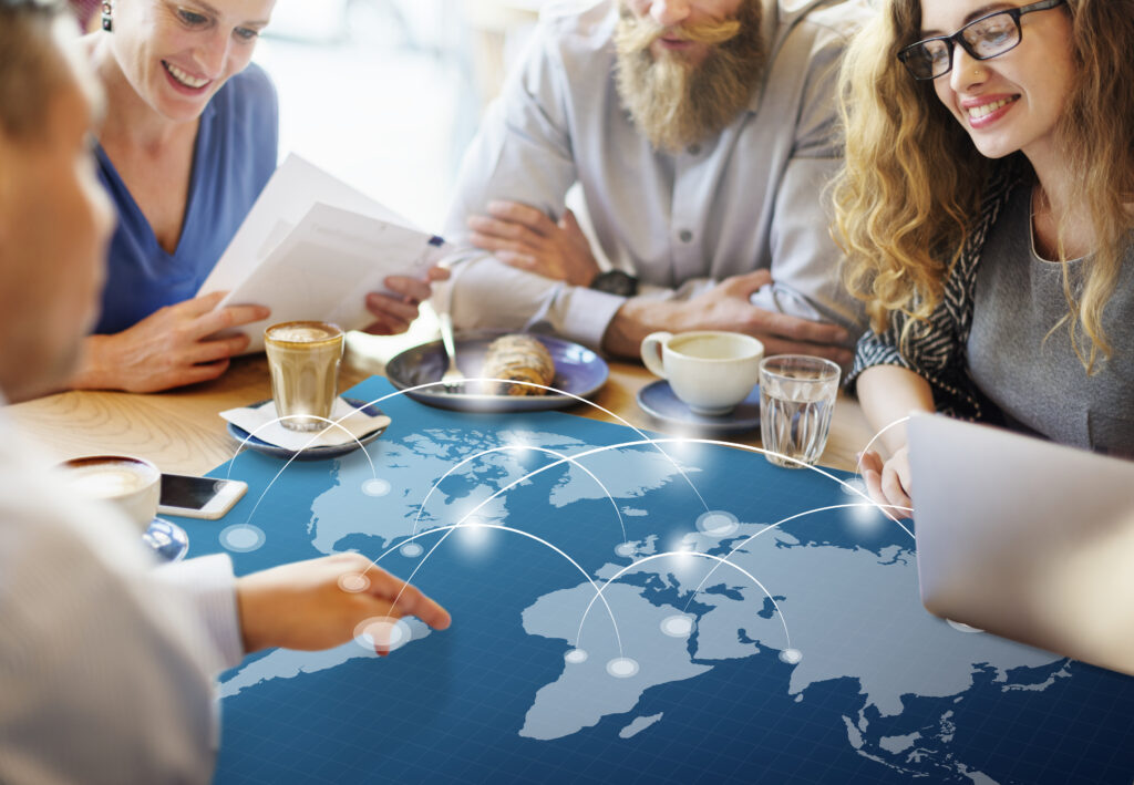 A diverse group of Global Talent visa professionals networking at a London innovation event in 2025, exchanging ideas and building international collaborations.